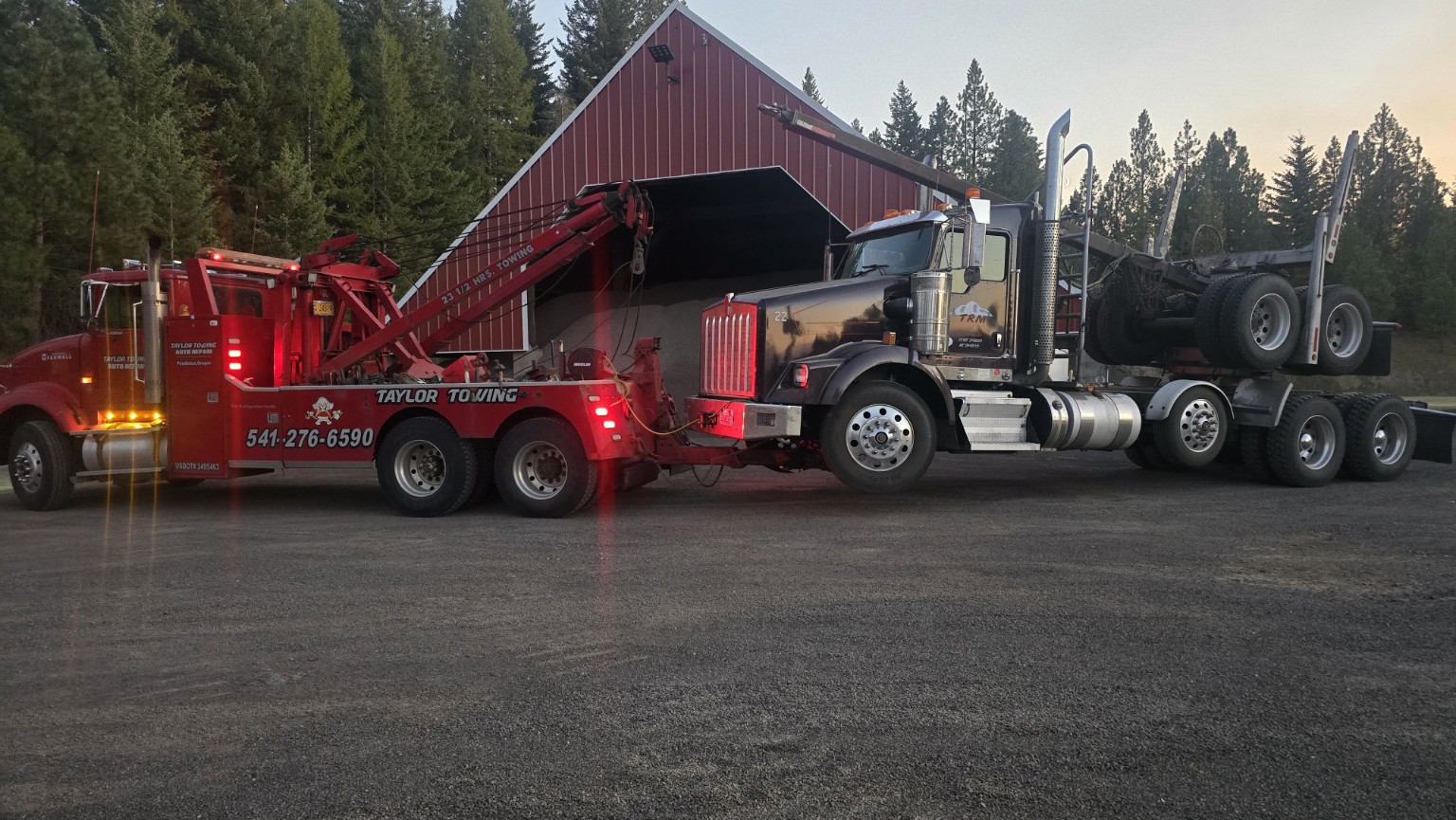 Taylor Towing heavy wrecker recovering a commercial truck