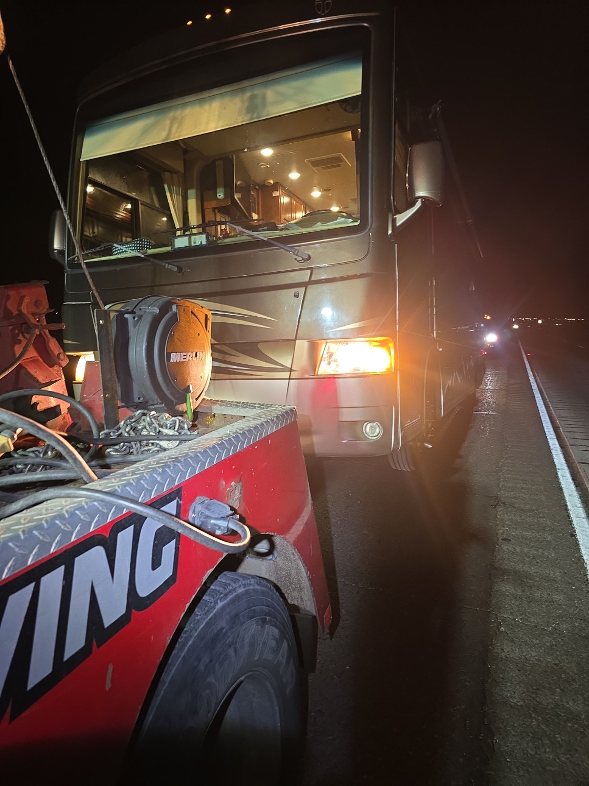 Taylor Towing assisting a motorhome at night